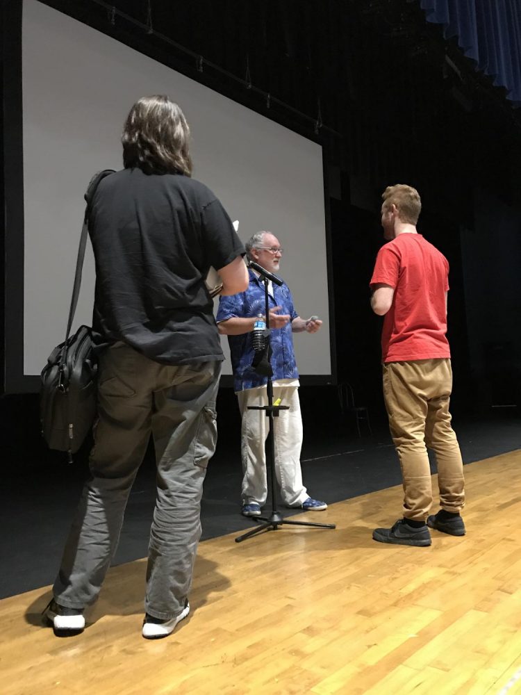 Motivational speaker Kevin Wanzer speaks to a couple of students after his three presentations in the large auditorium. Mr. Wanzer delivered a message of treating people with kindness and understanding. 