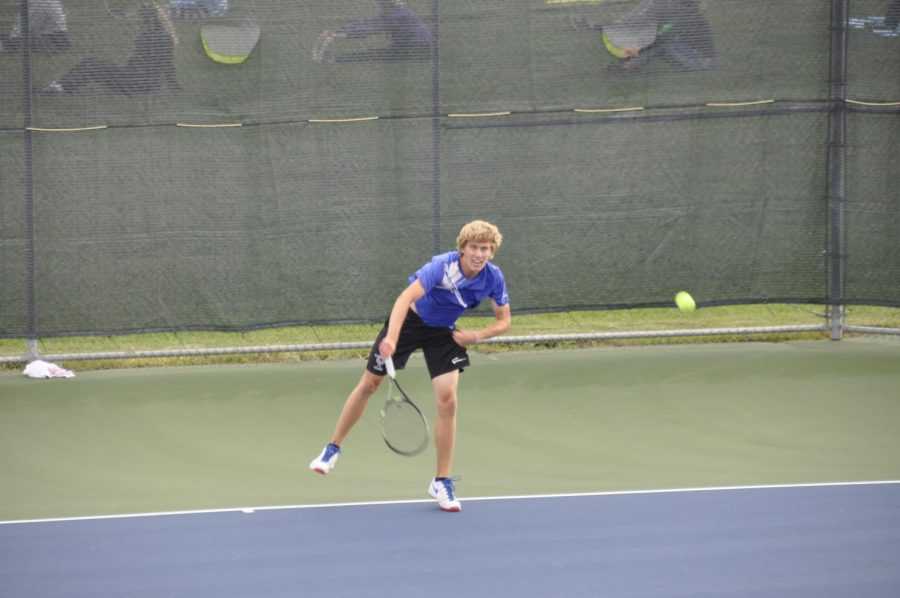 With his second serve, senior Ethan Radke blisters the ball at Adams Centrals Jaxon Rinkenberger. Photo by Collin Cowart