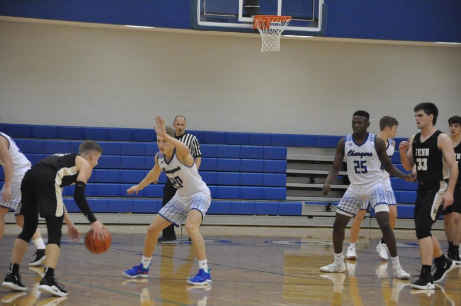 Seniors Preston Shearer and David Ejah lead the Chargers against Penn High School in an early season loss. Final score Penn 65-49. Photo by Malia Williams 