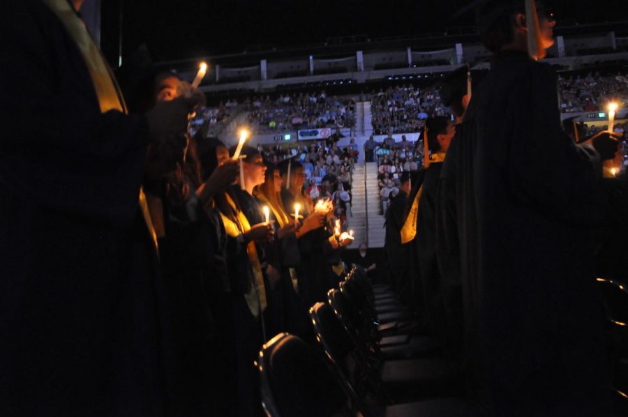 2019 graduates light candles to close out the last years ceremony at the Allen County Memorial Coliseum. This years graduation ceremony has been postponed because of the coronavirus outbreak. 