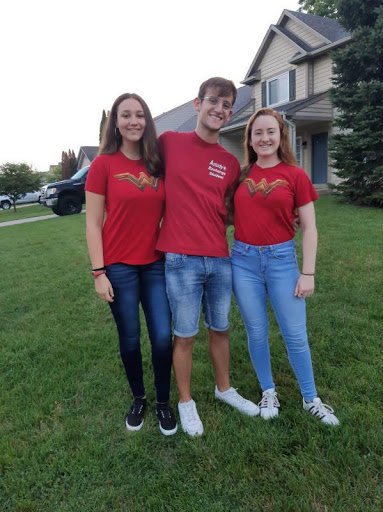 Exchange students Maria Santamarina Gonzalez and Alessandro Brazzo live in the home of Junior Etheny McCall. They celebrate homecoming week by sporting the junior class color. 