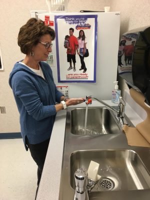 Nurse Ann Kline demonstrates the proper way wash your hands. She recommended getting under your nails and scrubbing all the nooks and crannies in your hands. Wash for 20 seconds or about as long as it takes to sing Happy Birthday. 