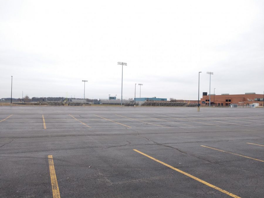 The student parking lies empty on a Monday in March. Usually this lot is full of student cars, even in the summer, the lot is half full with students at practice. 