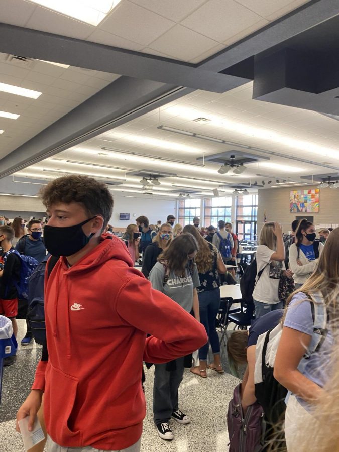 Waiting for 9:55 for the hallways to open, students pack in by the lunchroom doors. The recommend 6 feet social distancing is no where to be seen and most students talking with their friends have the noses hanging out of their masks. With the CDC recommendations students across the nation are wearing masks to slow down the spread of Coivd-19. 