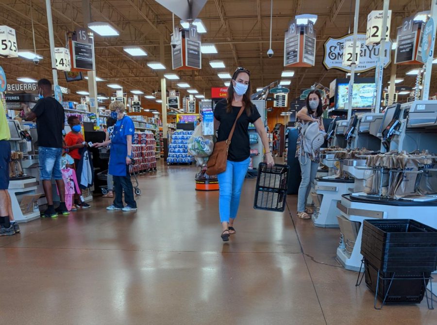 Shoppers in August  check out their groceries, while following the mandatory mask rules at Kroger on Dupont Road.