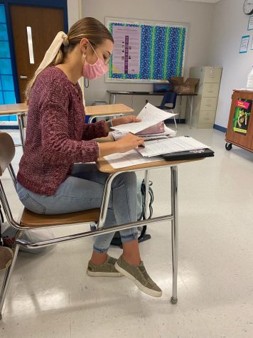 Senior Grace Lane studying in the classroom.
