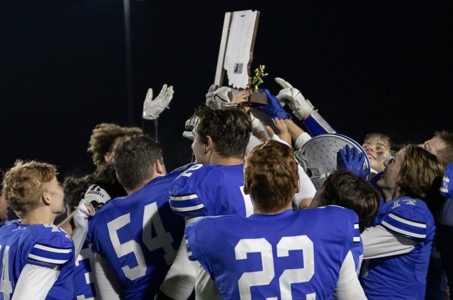 Players celebrate with sectional champion plaque via @leveragephotography on Instagram
