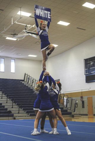 Olivia Powers, a flyer, holds up a sign