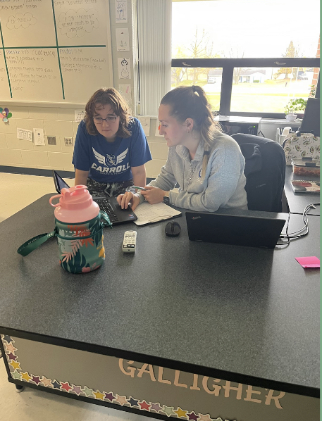 Mrs. Galligher assisting her seniors during her Technical Communications class.