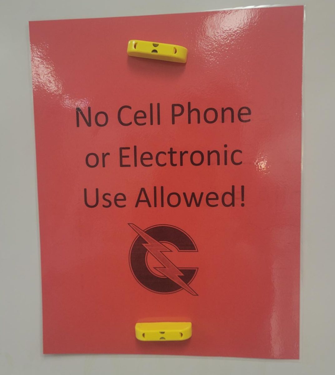 New sign indicating classroom cell phone policy flipped to 'no'