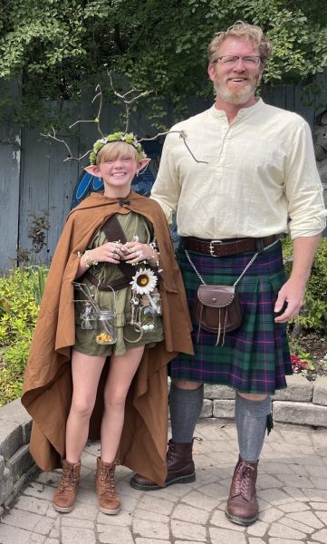 Mr. Brian Hill shows off his kilt with his daughter. Mr. Hill wears a kilt on every Friday to school. Courtesy photo