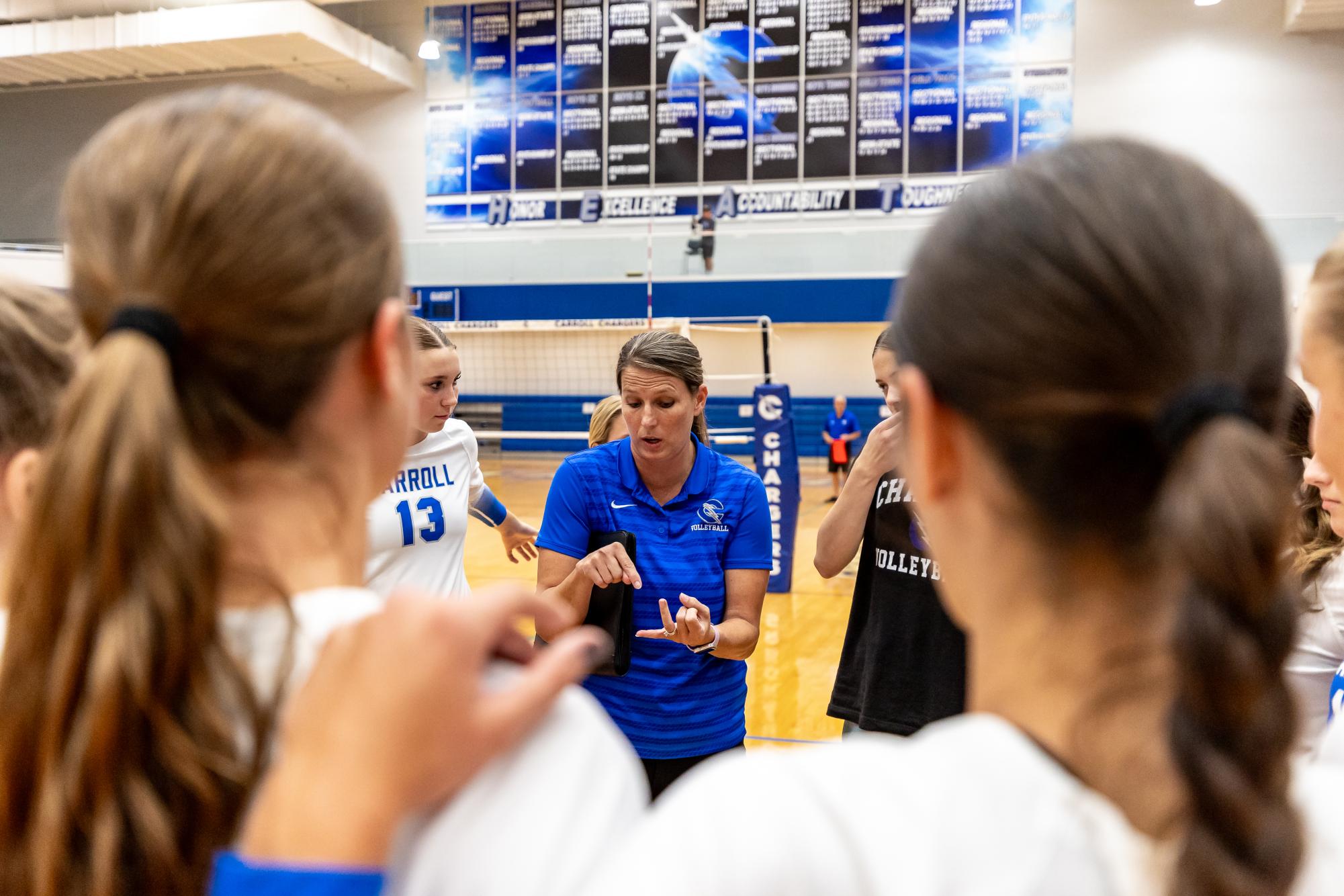 Head Coach Pandy Sinish working with her team during a time out. 