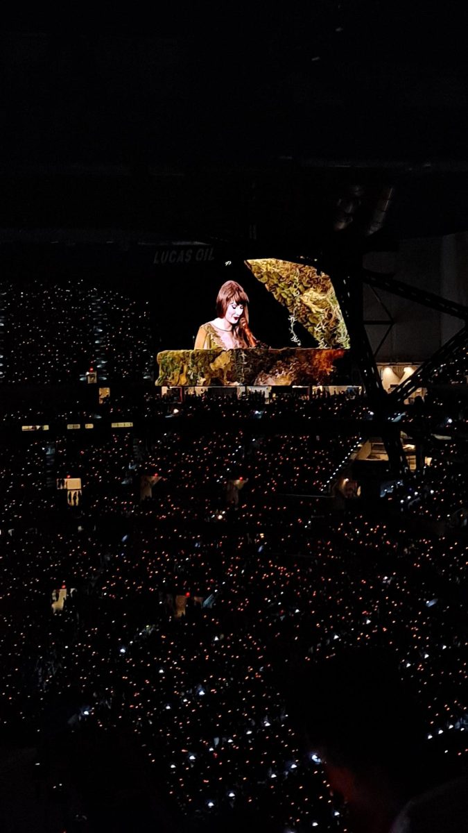 Taylor playing the Folklore/Evermore piano for her Eras Tour.