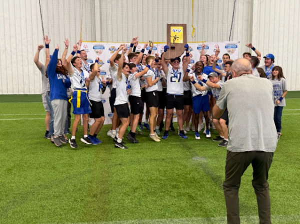 Members of the Unified Flag Football team pose with the state title trophy won in Indianapolis earlier this school year. 