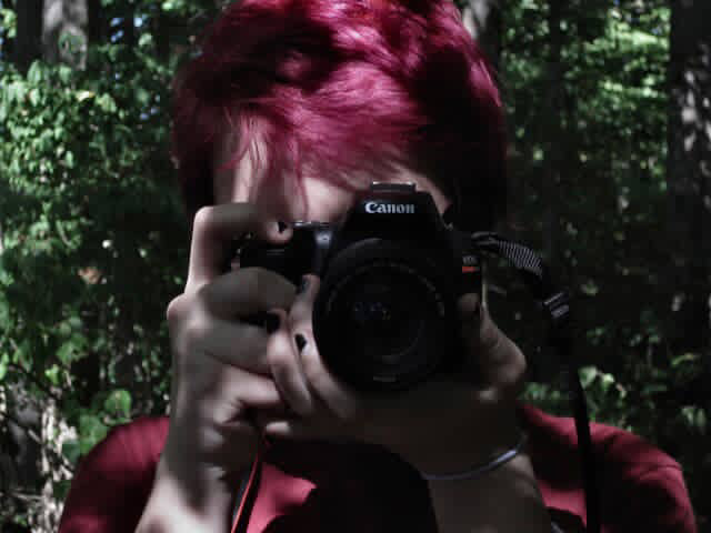 Lilly Bryan Holding Camera up to their face