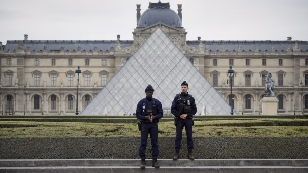 Police Officers standing guard outside of the Louvre Museum on October 19, 2025.